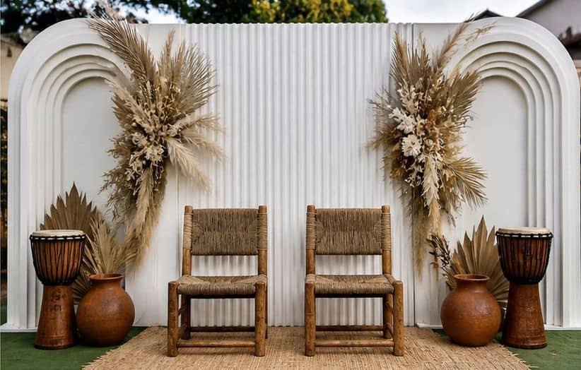 Event décor backdrop with earthy styling and seating